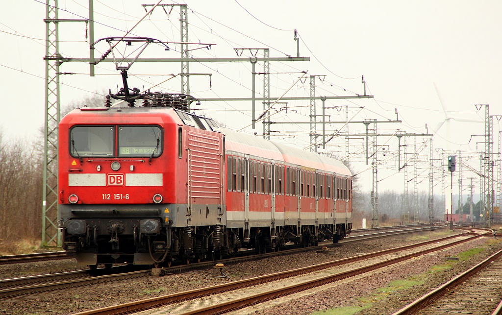 DB 112 151-5 als Schublok einer Regionalbahn nach Flensburg aufgenommen in Jübek. 24.03.2012