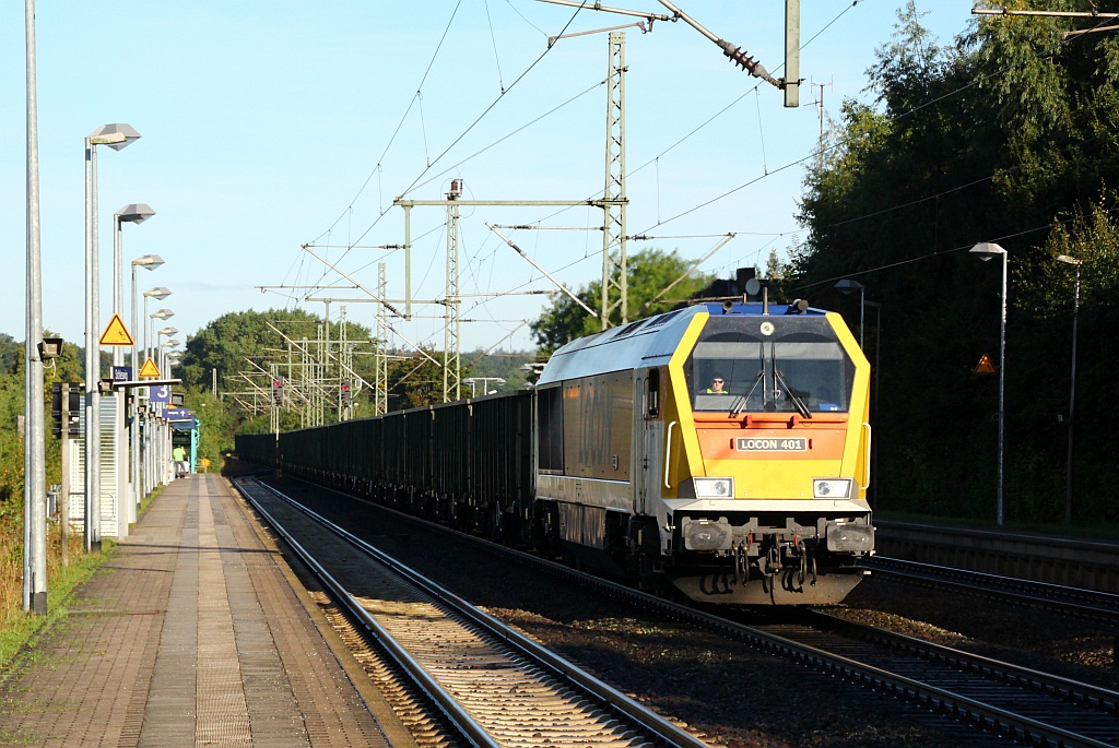 Locon 401/264 005-0 fährt hier mit dem DGS 25489(Jübek-Büchen/Straßfurt)und dem leeren Eaos Ganzzug durch Schleswig. 13.09.12