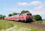 Kieler Woche....einer der wenigen Lok bespannten Züge die unterwegs sind...218 329-1 mit ihrem RE nach Kiel aufgenommen zwischen Flensburg und Süderbrarup.