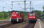 295 048-3 mit dem EK 53386 und 112 149-0 mit einer RB nach Flensburg aufgenommen im Bahnhof von Schleswig. 26.06.2010