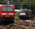 Zwei Generationen von E-Loks mal etwas anders festgehalten...die Trierer 143 366-3 und die für TXL fahrende MRCE 182 597-5 abgestellt im Hbf Koblenz. 16.09.2013