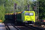 AlphaTrains/CFL 185 534-5 rauscht hier mit einem Holzzug aus Padborg/DK durch Schleswig gen Hamburg. 18.05.2014