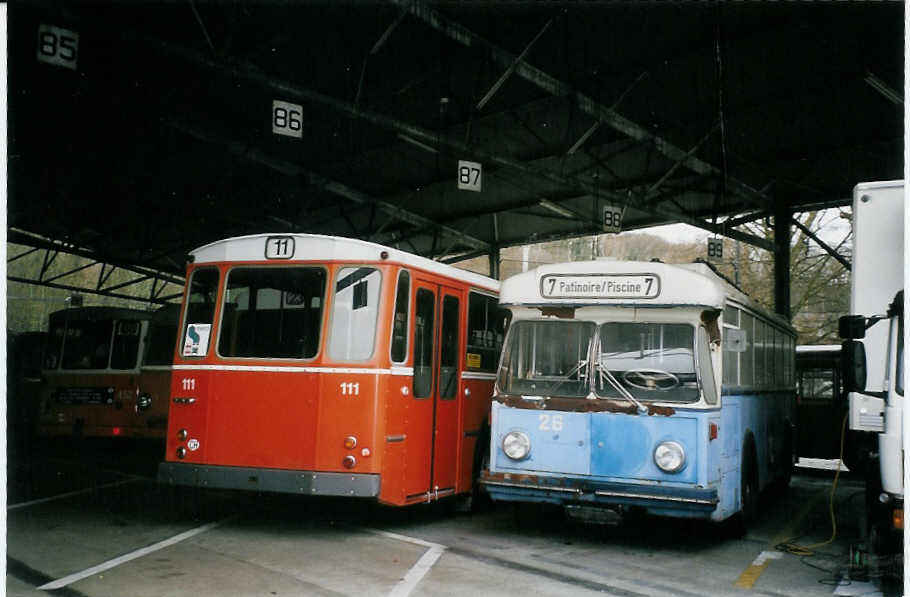 (066'232) - TPG Genve (AGMT) - Nr. 111 - FBW/Hess + TC La Chaux-de-Fonds (AGMT) - Nr. 26 - Saurer/Haag Trolleybus (ex VBZ Zrich Nr. 801 + 1) am 21. Mrz 2004 in Genve, Dpt TPG