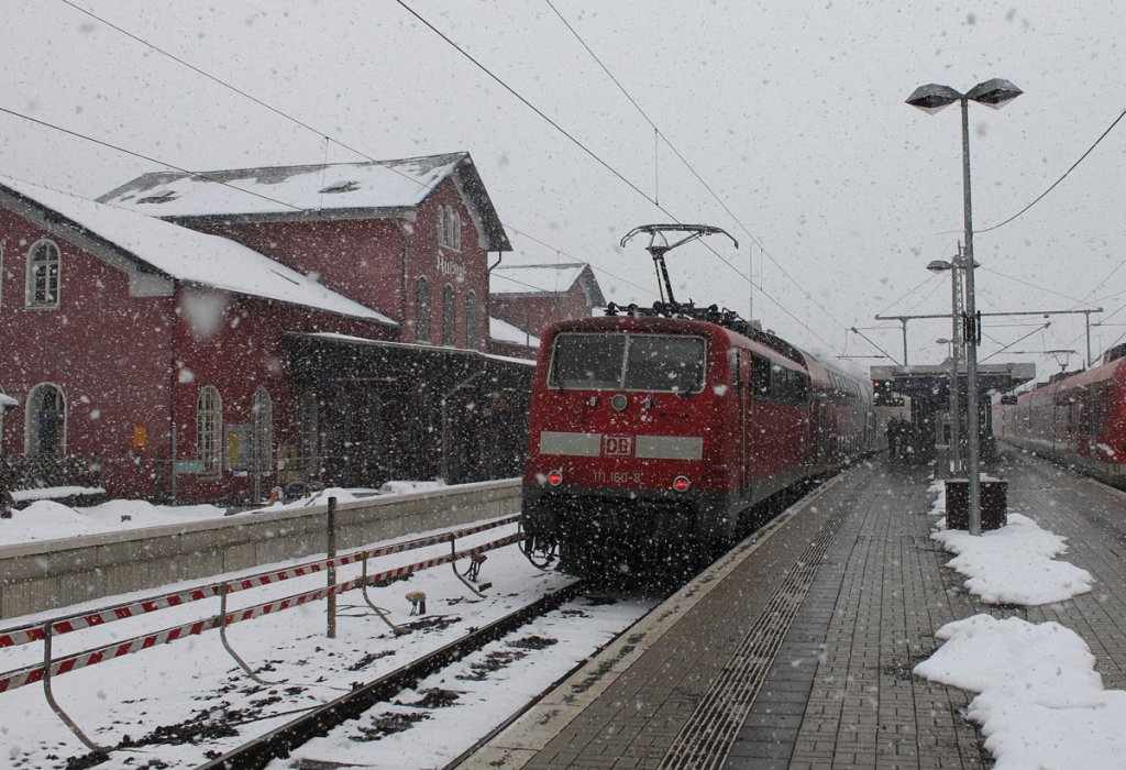 111 160-8 mit ihrem RE9 nach Aachen in Au(Sieg) am 14.03.2013 bei einem starken Schneeschauer... 