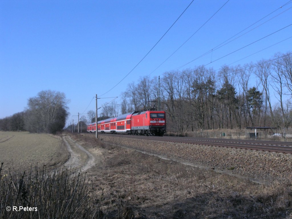 112 188 schiebt RE18176 nach Brandenburg HBF bei Jacobsdorf(Markt). 08.03.11