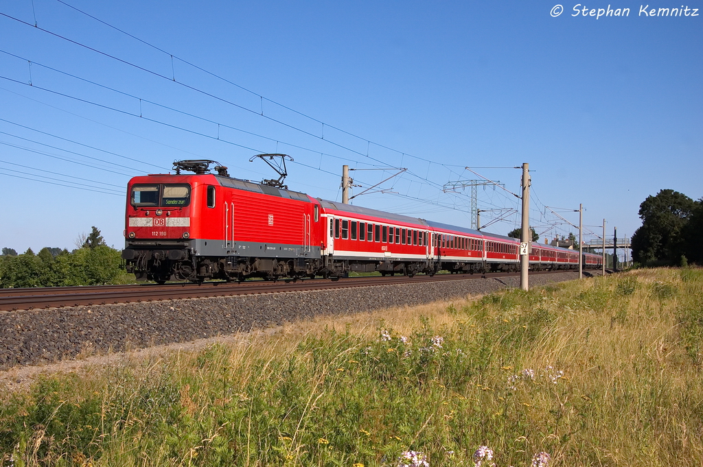 112 190 mit einem Kreuzfahrersonderzug von Berlin nach Rostock-Seehafen in Vietznitz. 20.07.2013