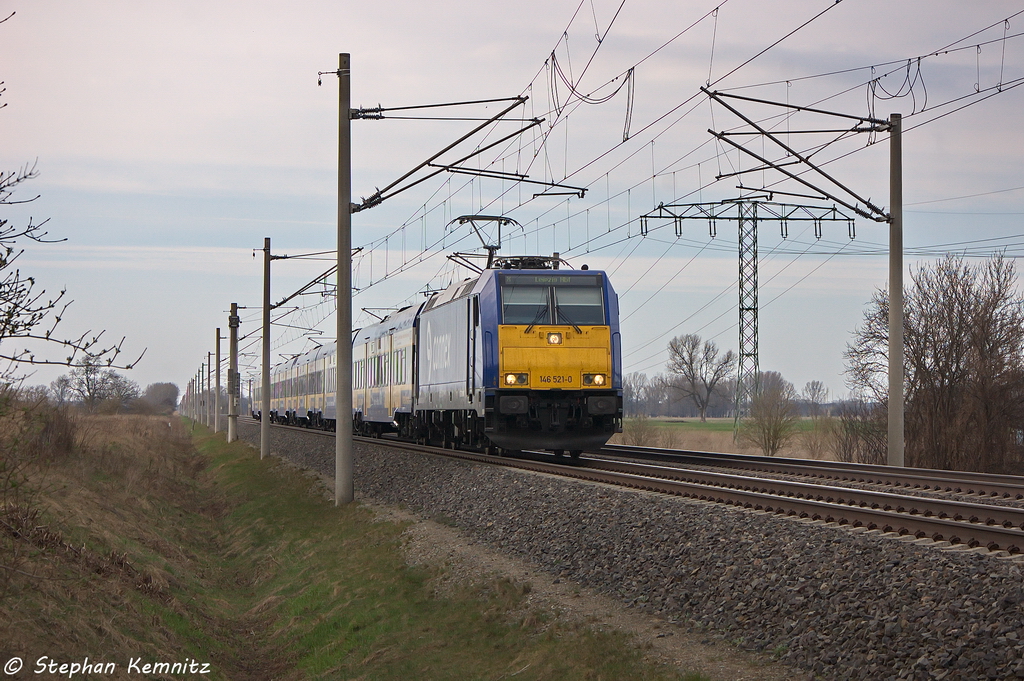 146 521-0 Captrain Deutschland GmbH mit dem Interconnex (X 68904) von Warnemnde nach Leipzig Hbf in Vietznitz. 18.04.2013