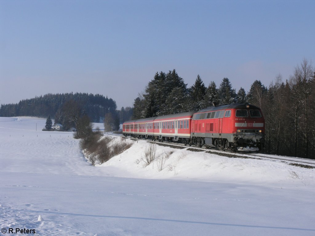 218 458-8 zieht bei Ksers den RE32715 nach Obersdorf. 15.02.10