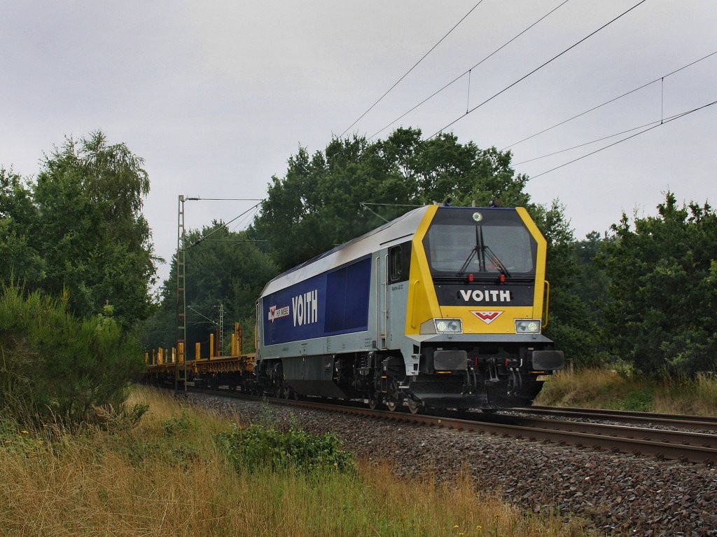 Ein Maxima am 11.08.2010 mit einem Bauzug unterwegs bei Eystrup. 
