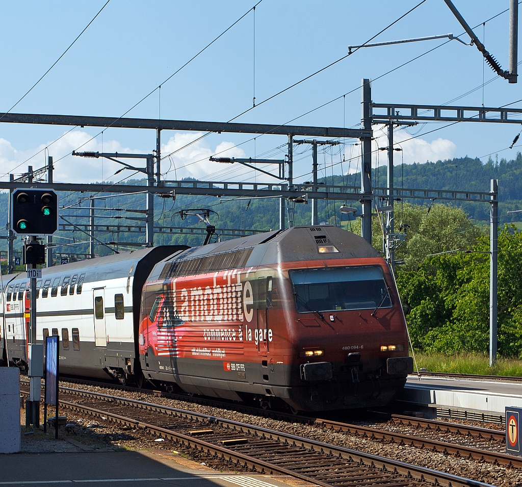 Re 460 094-6  Raetia  (mit Werbung fr Carsharing Schweiz) mit DoSto IC kommt von Lausanne und fhrt am 28.05.2012 in den Bahnhof Palzieux ein. Der Taufname der Lok  Raetia  bezieht sich auf die ehemalige rmische Provinz Raetia.