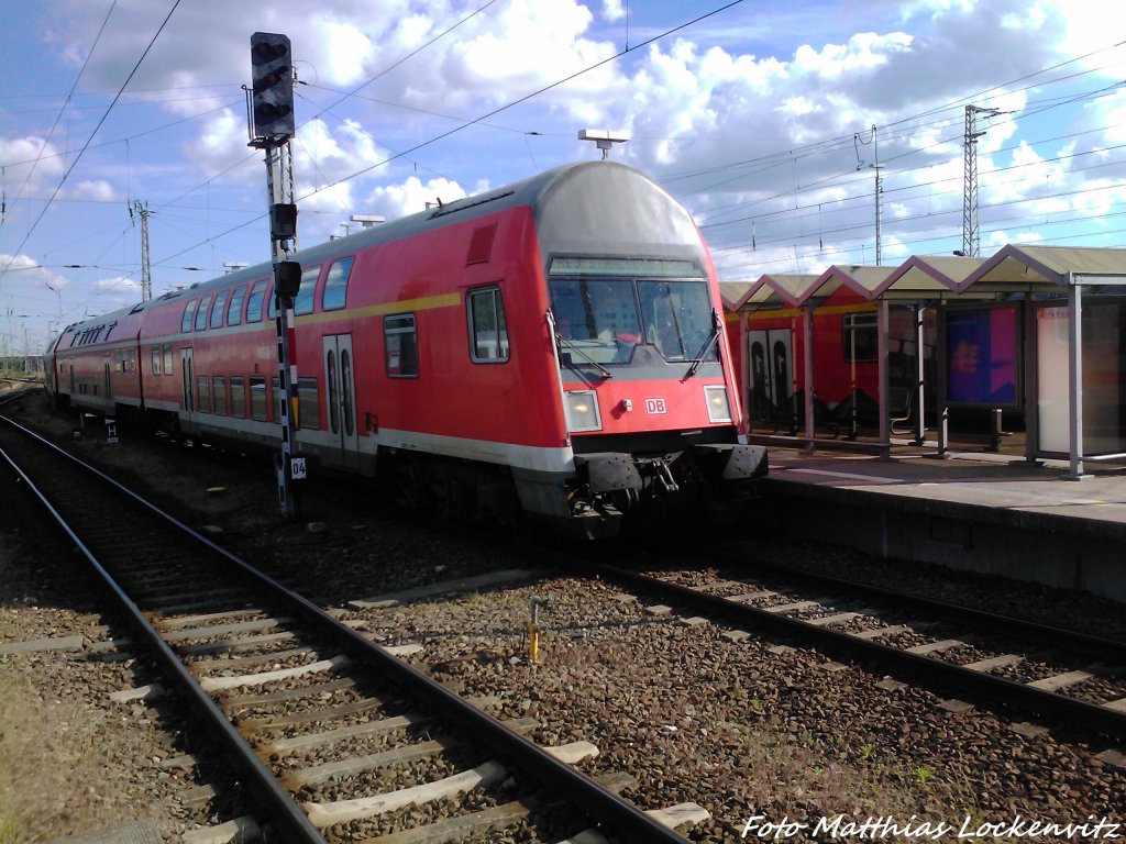 RE3 mit einer BR 112 bei der Einfahrt in Stralsund Hbf am 10.6.13