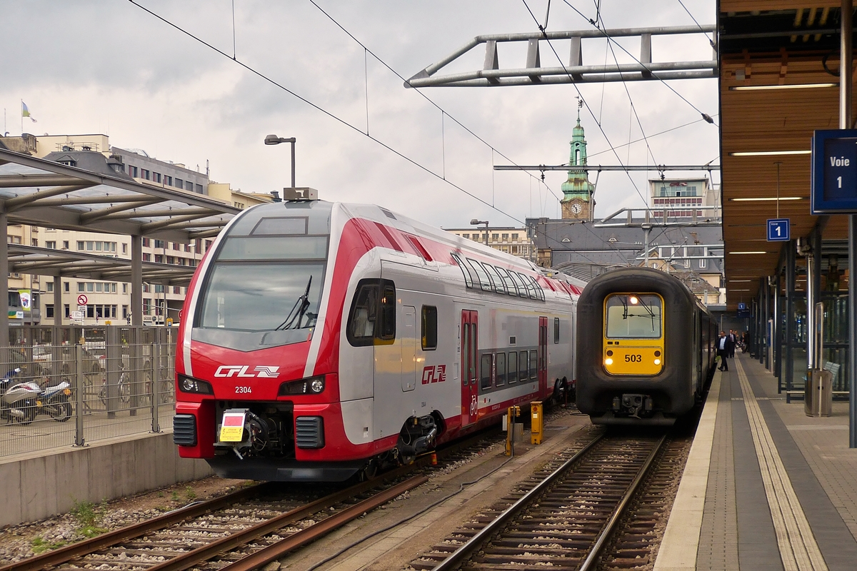 . Am 27.05.2014 reisten wir von Herdorf zurck nach Hause und im Bahnhof von Luxemburg hatte ich noch die Gelegenheit den CFL KISS Z 2304 zusammen mit der SNCB Gumminase AM 96 503 abzulichten. (Hans)