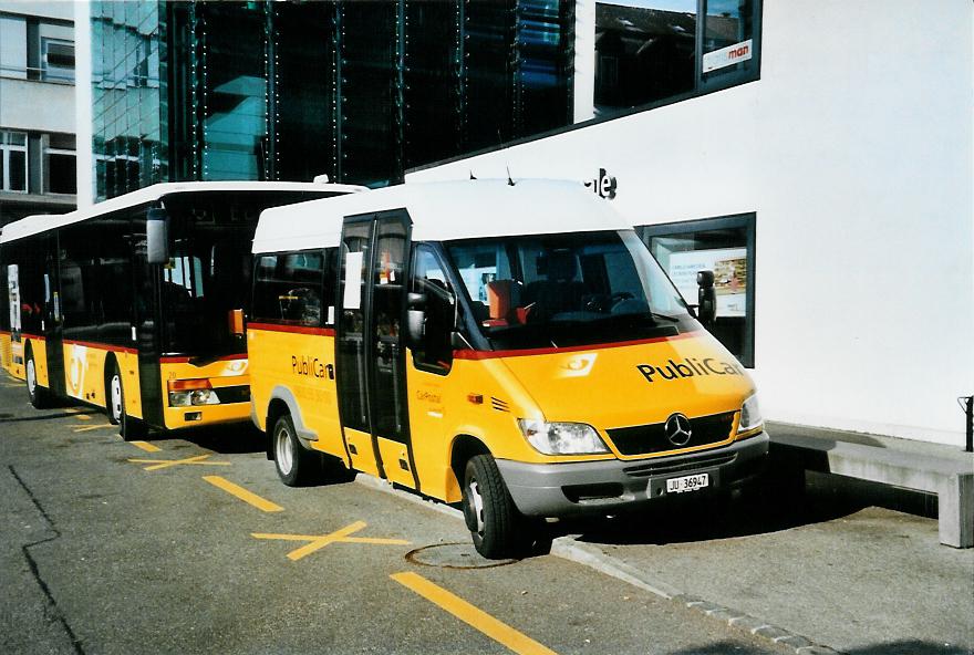 (104'509) - CarPostal Ouest - JU 36'947 - Mercedes/VDL-Kusters am 20. Februar 2008 beim Bahnhof Delmont