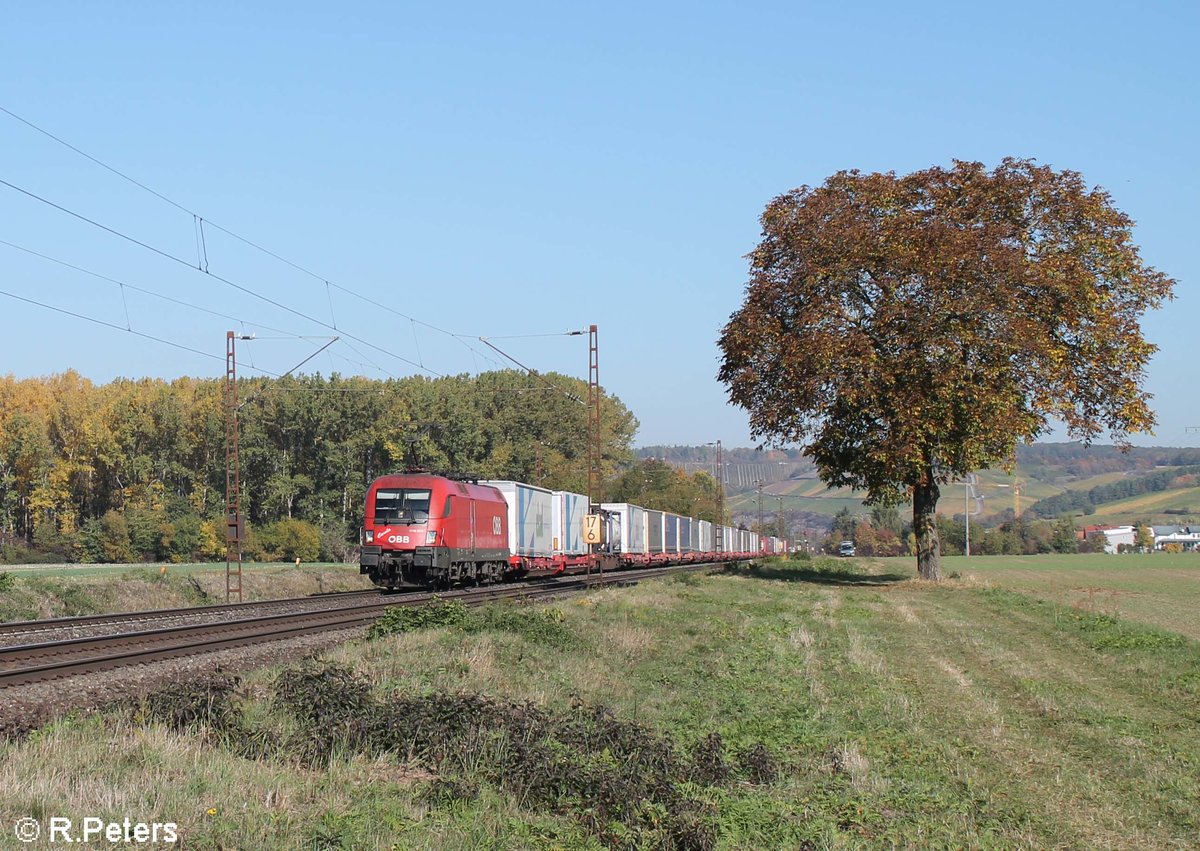 1116 269-0  Carola  zieht ein Wechselpritschenzug kurz vor Retzbach-Zellingen .13.10.18