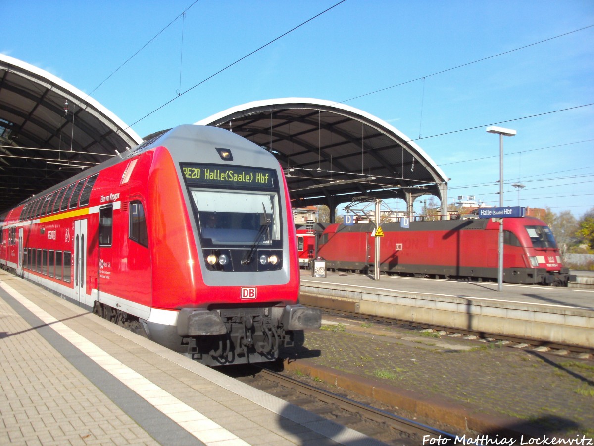 182 025-7 mit der RegionalBahn mit ziel Eisenach und Ein Dosto-Steuerwagen als RE20 mit ziel Halle (Saale) Hbf im Bahnhof Halle (Saale) Hbf am 1.11.14