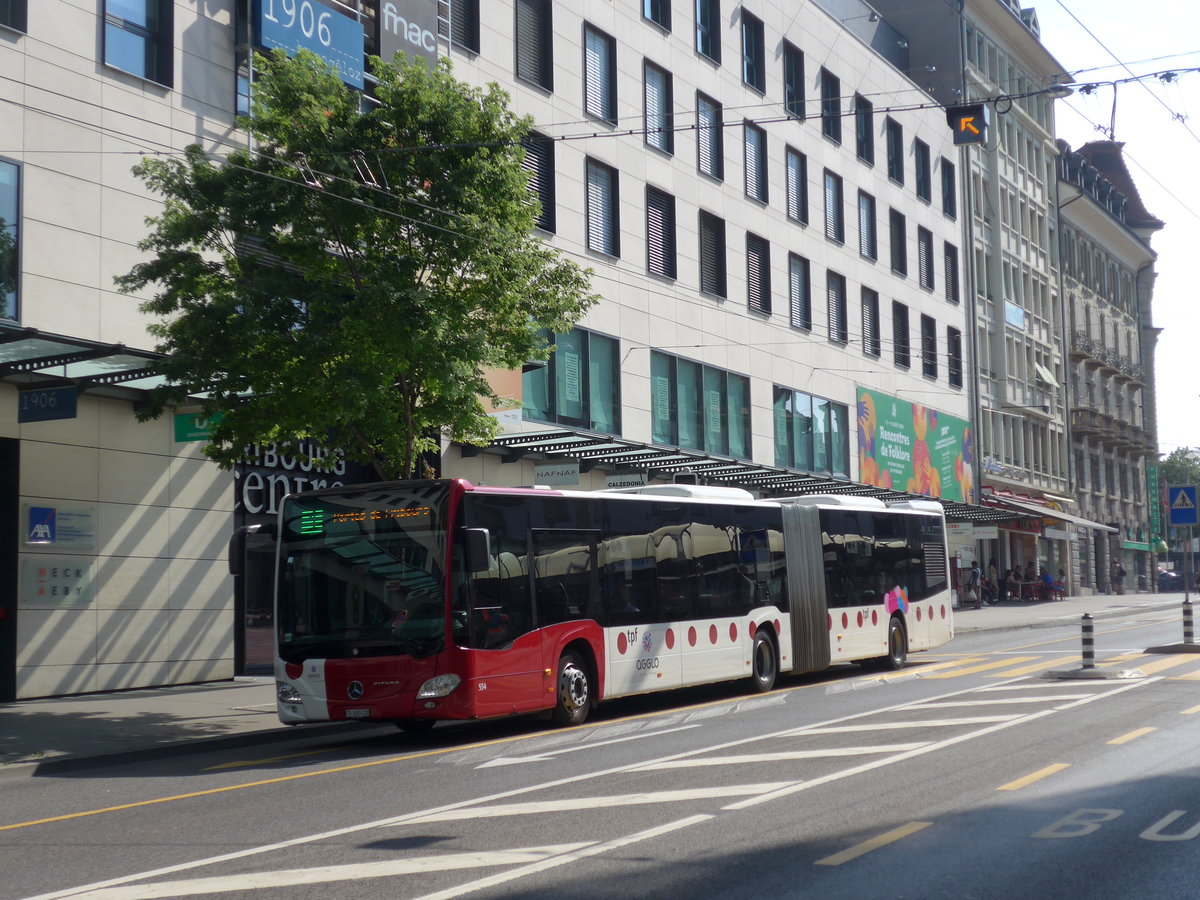 (195'632) - TPF Fribourg - Nr. 554/FR 300'410 - Mercedes am 5. August 2018 beim Bahnhof Fribourg