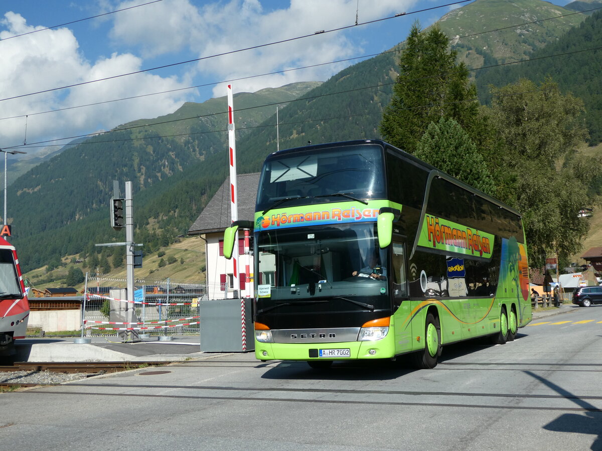 (238'376) - Aus Deutschland: Hrmann, Augsburg - Nr. 7002/A-HR 7002 - Setra am 24. Juli 2022 beim Bahnhof Ulrichen