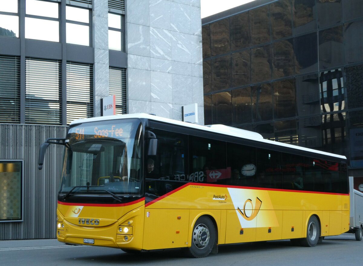 (246'016) - PostAuto Wallis - VS 552'119/PID 11'908 - Iveco am 11. Februar 2023 beim Bahnhof Visp