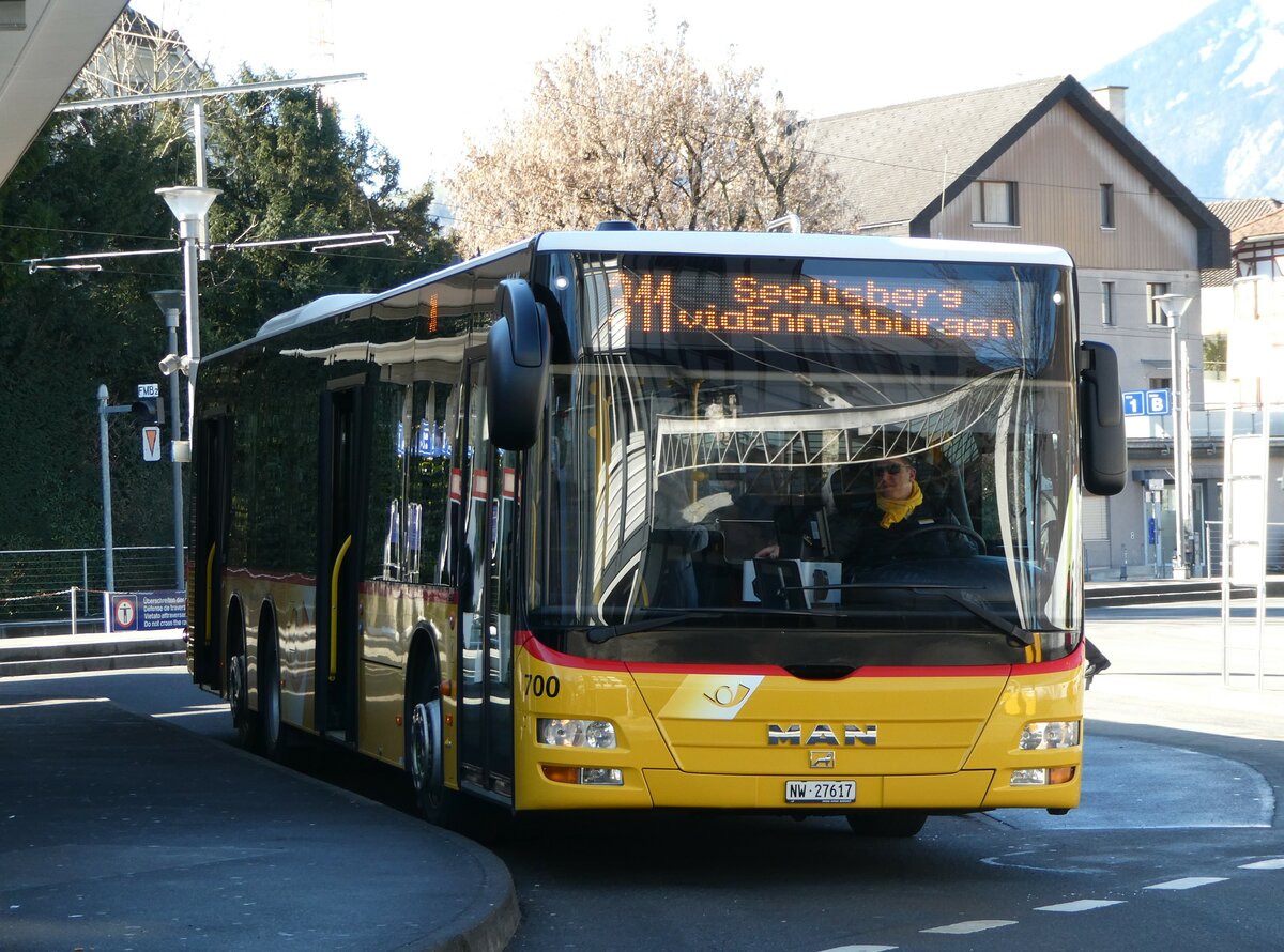 (246'165) - PostAuto Zentralschweiz - Nr. 700/NW 27'617/PID 5569 - MAN (ex Niederer, Filzbach Nr. 12; ex PostAuto Ostschweiz) am 16. Februar 2023 beim Bahnhof Stans