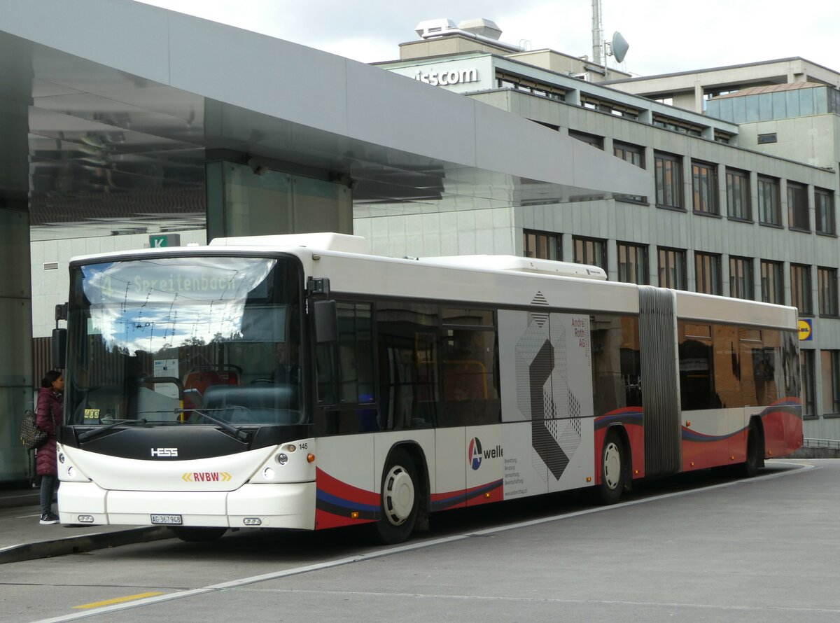 (256'754) - RVBW Wettingen - Nr. 145/AG 367'948 - Scania/Hess am 6. November 2023 beim Bahnhof Baden