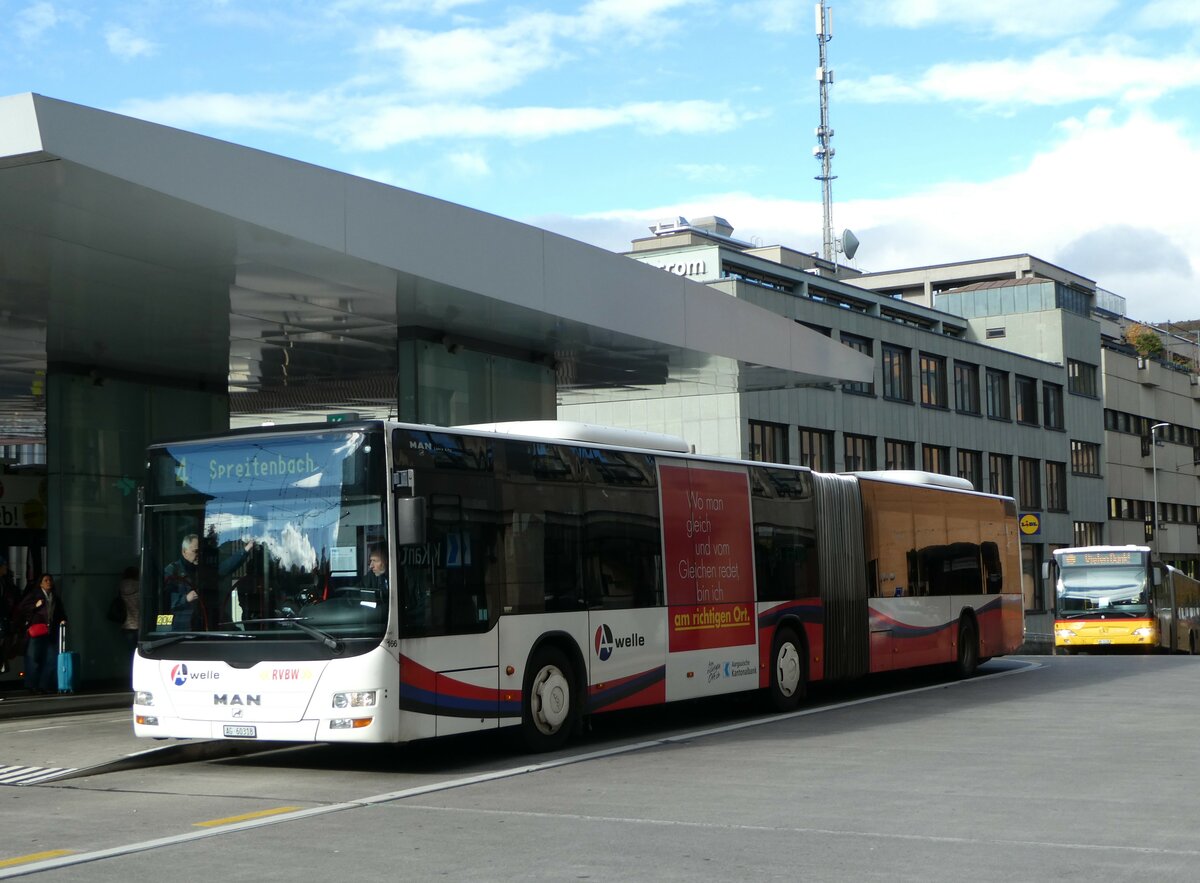 (256'786) - RVBW Wettingen - Nr. 166/AG 60'318 - MAN am 6. November 2023 beim Bahnhof Baden