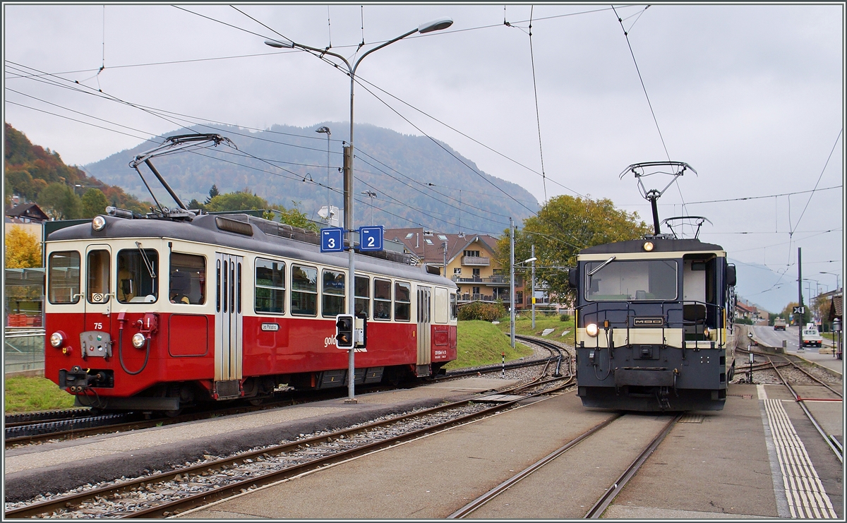 CEV BDeh 2/4 N° 75 und MOB GDe 4/4 in Blonay. 
19. Okt. 2015