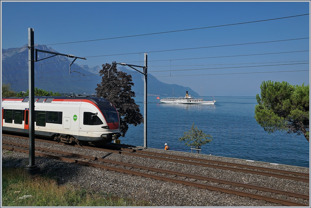 Der Flirt und ein Schiff - ein Versuch, Zug und Schiff auf einen Bild zu zeigen.

Bei Villeneuve, den 21. Aug. 2018