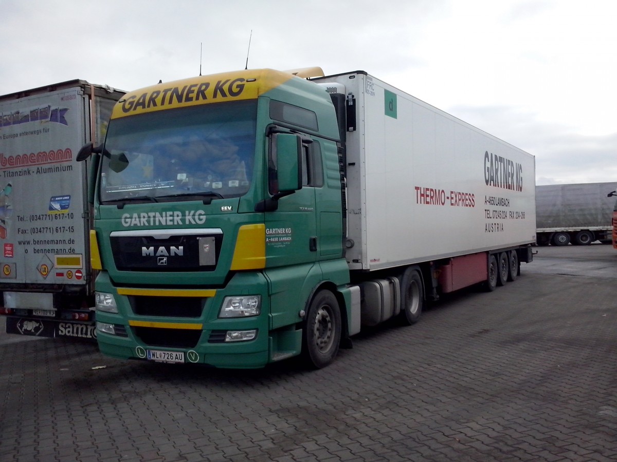 SZM MAN TGX 18.440 mit Khlkofferauflieger der Spedition Grtner KG gesehen auf dem Autohof in Grnstadt am 12.02.2014