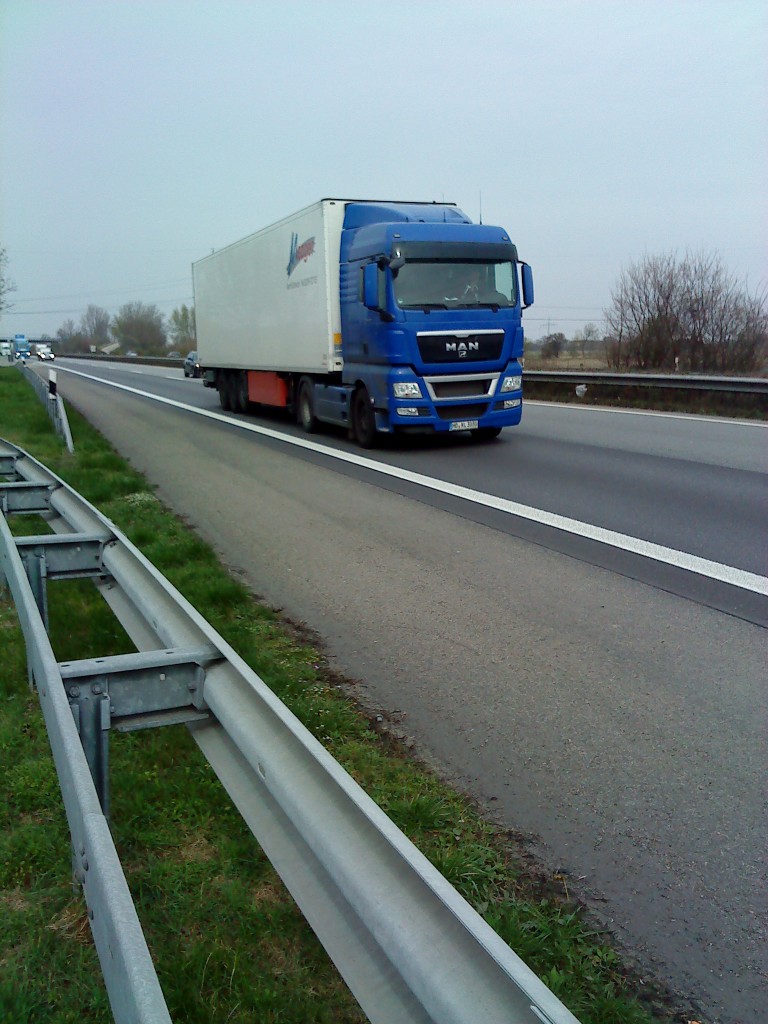 SZM MAN TGX 18.440 mit Khlkofferauflieger  gesehen auf der A 61 Hhe Rasthof Dannstadt am 18.03.2014