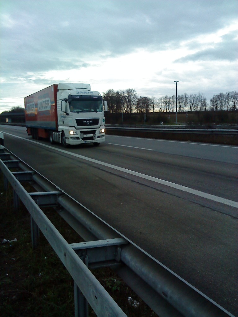 SZM MAN TGX 18.440 der Spedition Rhenus AG mit Kofferauflieger gesehen auf der A 61 an der Raststtte Schifferstadt am 06.01.2014