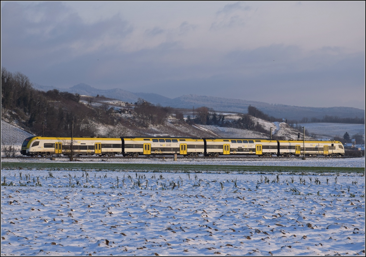 Zwischen Belchensystem und Blauendreieck. 

Ein Desiro HC von bwegt Richtung Basel bei Buggingen. Februar 2021.