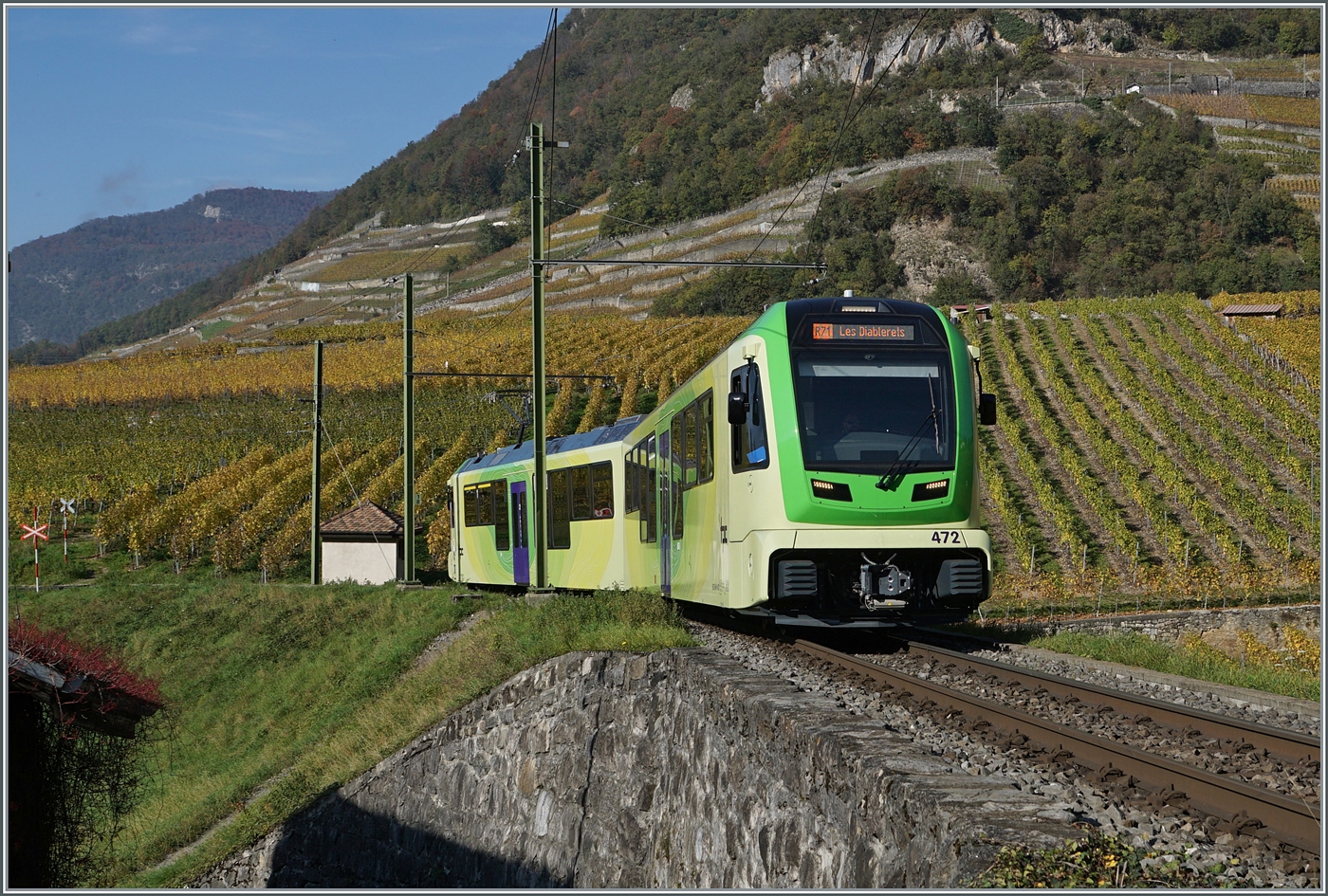 Der TPC ASD ABe 4/8 472 ist oberhalb von Aigle inmitten herbstlicher Rebstöcke als R71 auf der Fahrt nach Les Diablerets. 

2. November 2024
