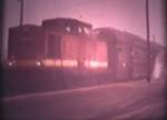 Eine unbekannte V100 mit einem Sonderzug der Konsumgenossenschaft Naumburg-Nebra im Bf Vitzenburg; 1970 (Film: Siegmund Rolke)
