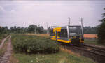KEG VT 3.14 als RB von Naumburg (S) Hbf nach Artern, am 09.07.2003 bei der Ausfahrt in Kirchscheidungen.