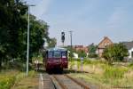 Das Ferkeltaxi 772 345-5 der Erfurter Bahnservice GmbH wartet am 24.08.2013 an einem schattigen Pl�tzchen im Bahnhof Ro�leben auf die R�ckfahrt als  Unstrut-Schrecke-Express  nach Naumburg Hbf.