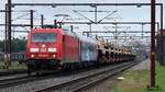 DBCSC 185 330-5 mit einem Militärtransport wartet im Bahnhof Pattburg auf Ausfahrt. Der Zug soll angeblich kurze Zeit später für einen Schaden an der Oberleitung im Bereich Rendsburg verantwortlich gewesen sein. Pattburg/DK 06.07.2025
