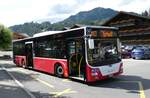 (278'567) - PostAuto Bern - BE 90'275/PID 11'337 - MAN (ex Dr. Richard, A-Wien Nr. 1413) am 5. August 2025 beim Bahnhof Saanen