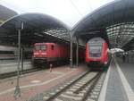 112 166 mit dem RE18 und daneben der RE30 im Bahnhof Halle (Saale) Hbf am 3.5.19