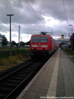 143 889-4 als S1 bei der Einfahrt in den Endbahnhof Warnemnde am 22.6.13