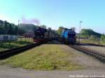 RBB 99 4011 bei der Einfahrt in den Bahnhof Putbus whrend dessen 251 901 den Personenzug Durchlassen muss um spter das Schlusslicht des Zuges zu bilden am 29.5.13