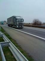 SZM Mercedes-Benz Actros 1844 mit Pritsche-Planen-Auflieger der Speditionsgruppe FERCAM gesehen auf der A 61 Hhe Rasthof Dannstadt am 18.03.2014