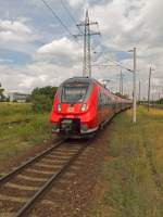 442 318 und 442 134 fahren am 27.06.14 als RB14 aus Nauen in den Bahnhof Berlin-Schönefeld ein.