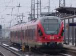 RE13009 von Rostock Hbf Richtung Sassnitz bei der Ausfahrt im Rostocker Hbf.(09.01.2011)