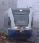 Rollender Joghurtbecher alias 646 der Usedomer Bderbahn als berfhrung von Rostock Richtung Seebad Heringsdof bei der Ausfahrt hinter Rostock Hbf.(23.01.2011)