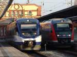 Treffen im Rostocker Hbf links die noch fahrende Ostseeland Verkehr GmbH nach Gstrow und rechts RB12 nach Graal-Mritz.(27.03.2011)