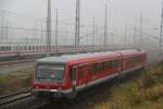 DB-Landplage in Form von 628 311 als Leerfahrt Richtung Schwerin/Lbeck bei der Ausfahrt im Rostocker Hbf.29.10.2011