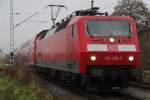 120 205-0 mit RE 1 Rostock-Hamburg kurz nach der Ausfahrt im Rostocker Hbf.24.11.2011