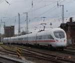 411 019-3 als ICE 1611 von Warnemnde nach Mnchen Hbf bei der Abfahrt im Rostocker Hbf.17.12.2011 