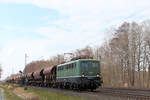 140 184-3 (Eisenbahnlogistik Vienenburg) mit einen Schotterzug am Haken, auf den Weg zur nächsten Baustelle.