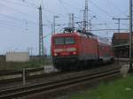 114 018 mit dem RE 18313 von Stralsund nach Elsterwerda,am 14.Mai 2011,beim Verlassen von Pasewalk.